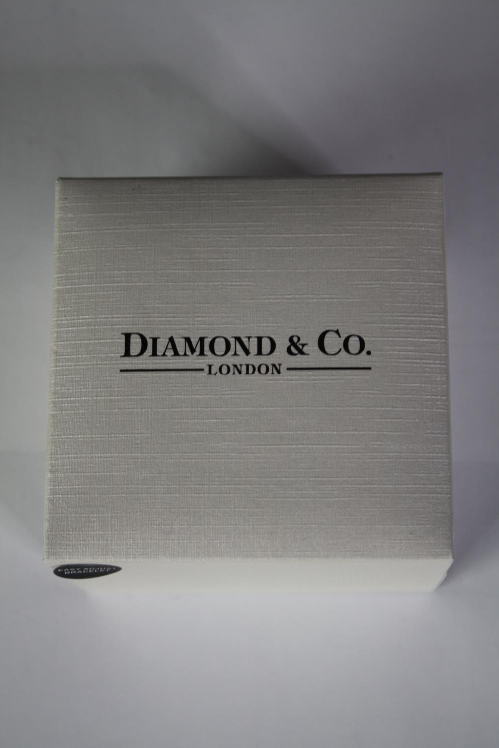 A boxed Diamond and Co ladies quartz watch with gold tone mesh strap and white dial. Box and papers. - Image 2 of 4