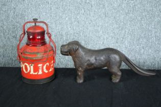 On old police lamp and a cast iron nutcracker in the shape of a dog. H.19 cm. (largest)