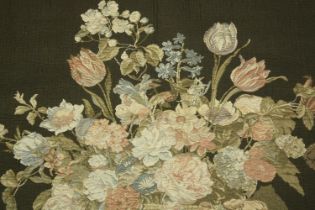 Embroidery. A wall hanging featuring a still life of flowers. With well detailed edging and wall