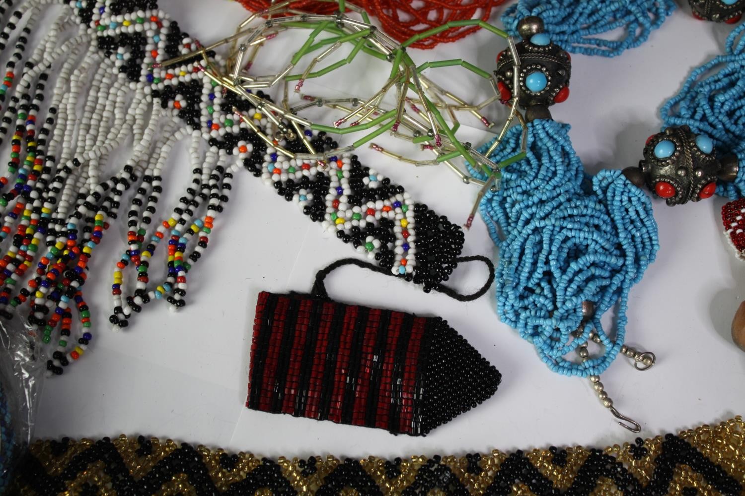 A collection of tribal beaded jewellery, including necklaces, belts and bracelets. With various - Image 3 of 8