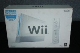 A boxed Nintendo Wii console. 25 W.38 D.11 cm.