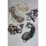 A collection of five mixed cultured pearl necklaces, including a multi strand pearl, amethyst,
