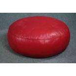 A large red leather floor cushion. H.40 Dia. 85cm.