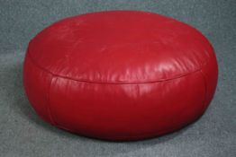 A large red leather floor cushion. H.40 Dia. 85cm.