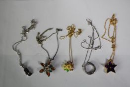 A collection of five silver and gold plated silver pendants and chain, set with various gemstones.