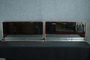 A pair of wall mirrors in gilt metal frames. H.40 W.90cm. (each)