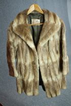 A vintage Robert Fraser winter fur coat with wide collar. Designer label to the inside of collar.