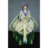 A Kevin Francis ceramic figure. Charlotte Rhead. Flat back. H.22cm.