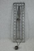 A metal framed ceiling hanging bottle rack. H.145 W42cm.