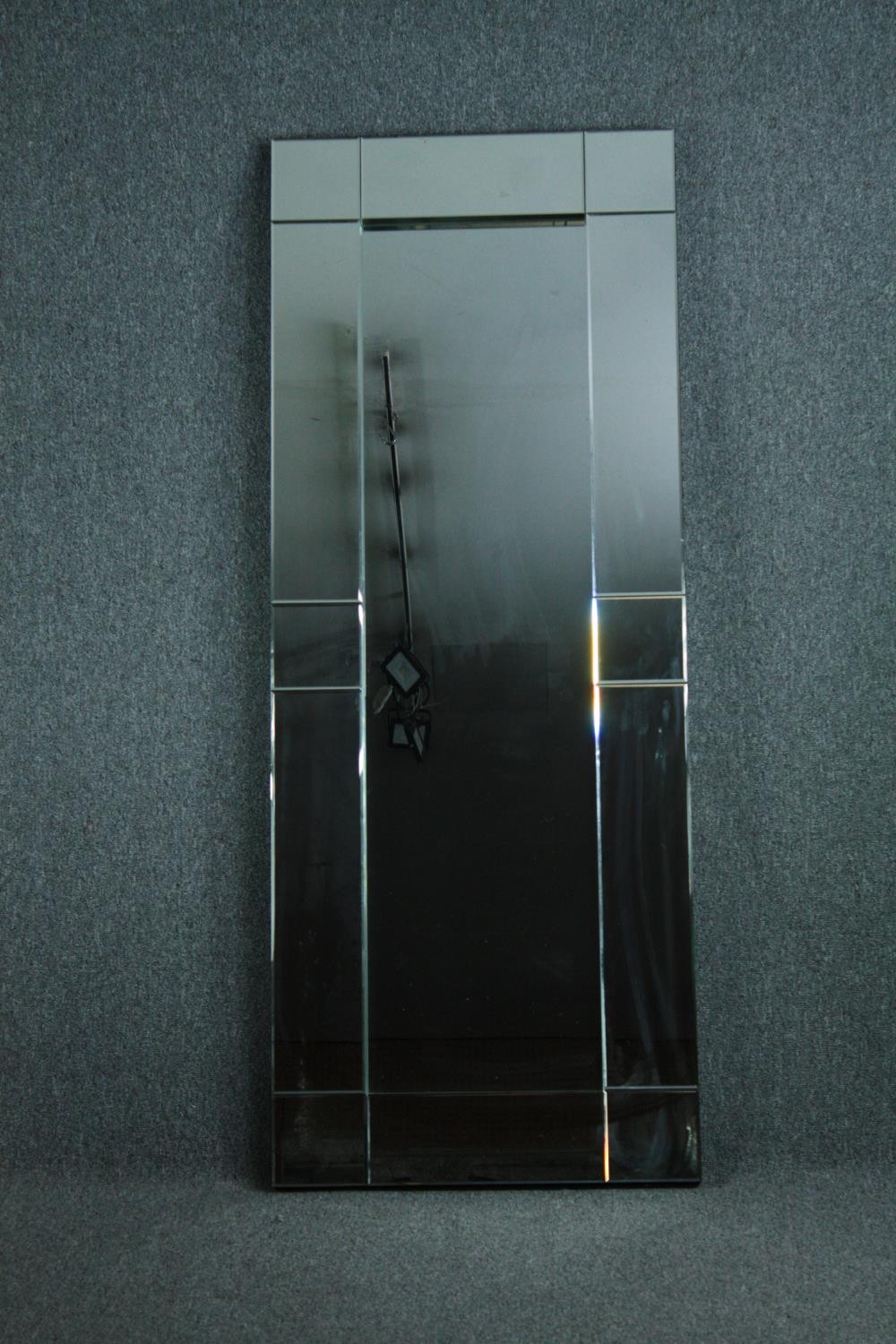 A contemporary full height wall mirror in glazed frame. H.180 W.70cm.