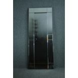 A contemporary full height wall mirror in glazed frame. H.180 W.70cm.