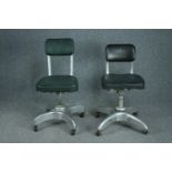 Two mid century aluminium framed revolving office desk chairs.