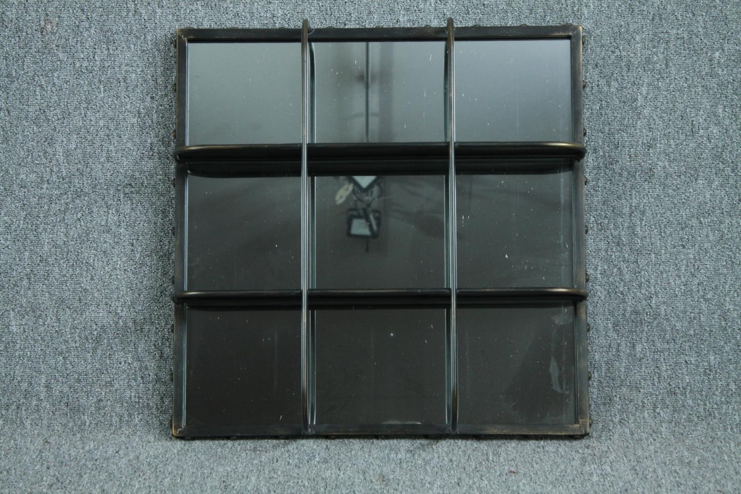 An industrial style metal framed bathroom mirror with shelving. H.61 W.61 cm.