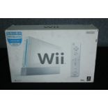 A boxed Nintendo Wii console. 25 W.38 D.11 cm.