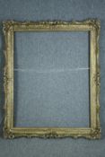 A large and ornate gilt frame. H.148 W.119 cm.