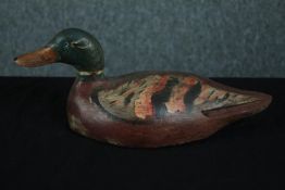 A carved mallard decoy duck. Hand painted. 19th century. H.13 W.31 D.12 cm.