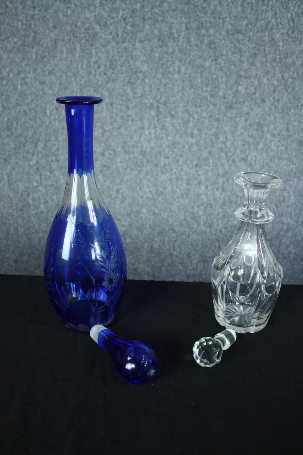 Two decanters. Blue glass with an etched floral pattern. The other, smaller and clear glass H. - Image 4 of 4