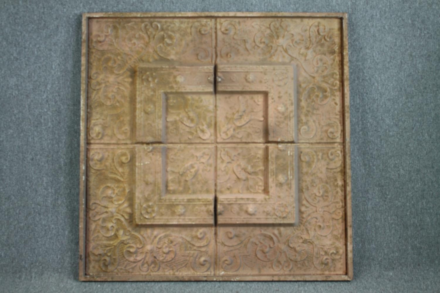 A large decorative pressed metal relief panel. H.128 W.128cm.