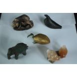 A collection of stone and metal animals, including a Chinese carved soapstone mother pig and babies,