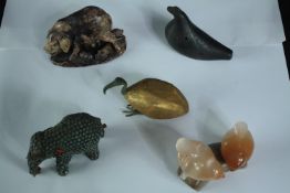 A collection of stone and metal animals, including a Chinese carved soapstone mother pig and babies,