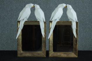 A pair of contemporary mirrors with parrots perched on the top rail. H.60 W.32cm. (each)