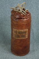 A boxing punchbag from the 'New York Boxing Club' dated 1982. Leather. H.67 Dia.32 cm.