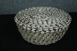 An African basket decorated with shells. H.13. Dia. 26cm.