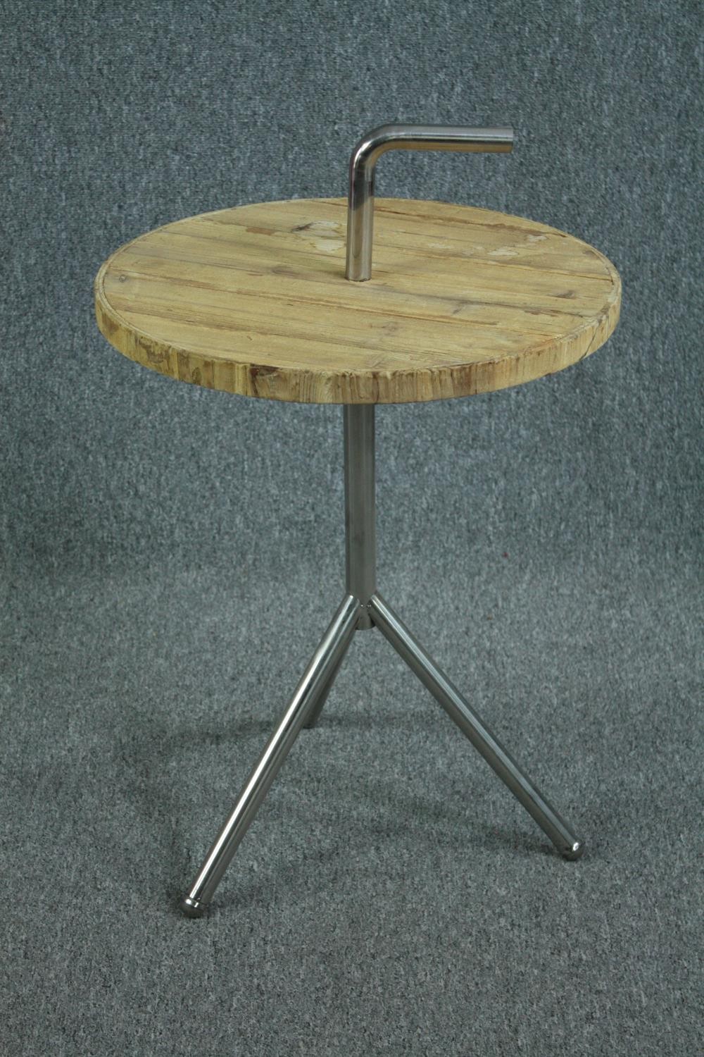 A contemporary industrial style occasional table. H.84 Dia.51cm.