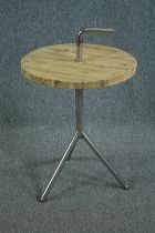 A contemporary industrial style occasional table. H.84 Dia.51cm.
