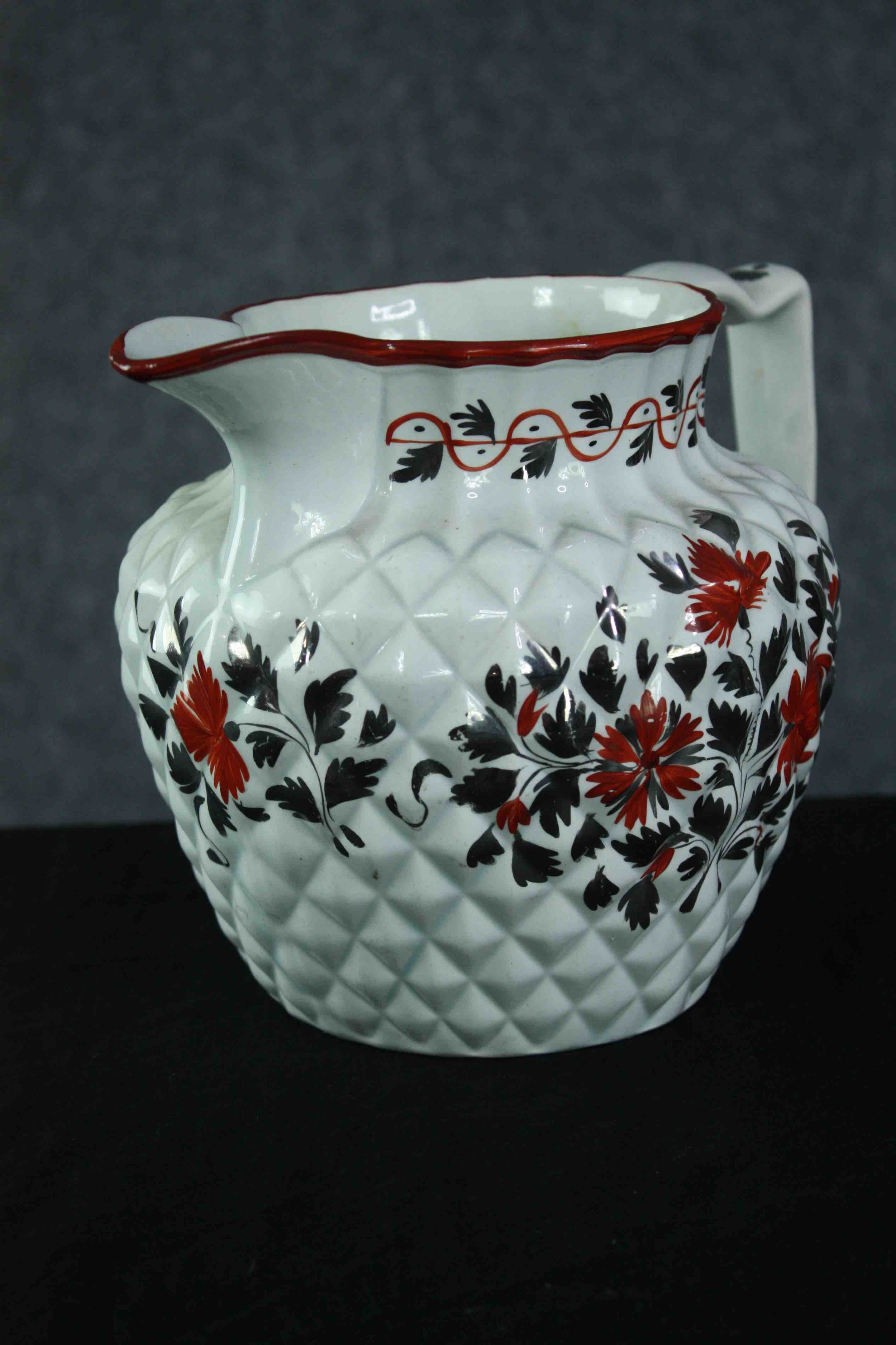 An early 19th century pineapple moulded jug with silver lustre and red enamel floral decoration. H. - Image 2 of 5