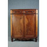 Cabinet, 19th century Continental flame mahogany. H.148 W.124 D.54cm. (Rear leg damaged as shown).