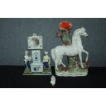 Staffordshire porcelain figures. A candleholder in the shape of a horse, a grandfather clock