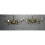 A matching pair of brass eight branch chandeliers with scrolling design. H.36 Dia.83 cm. (each)