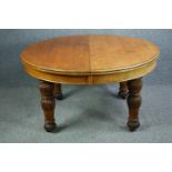 Dining table, mid 19th century oak, extending with three extra leaves. H.73 W.240 D.135cm. (extended