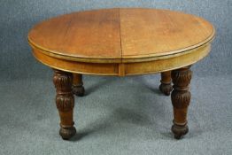 Dining table, mid 19th century oak, extending with three extra leaves. H.73 W.240 D.135cm. (extended