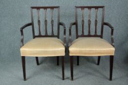 A pair of Georgian style mahogany armchairs.