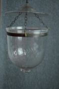 A glass ceiling candle holder with etched floral pattern. H.30cm.