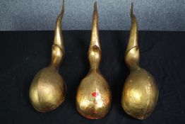 Three gold painted pieces of wall art. L.61 cm. (each)