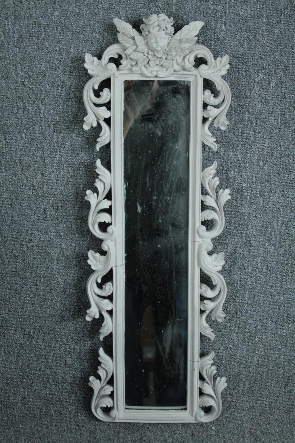 A pair contemporary pier mirrors with floral decorated frames and cherub surmounts. H.80 W.28cm. ( - Image 3 of 5