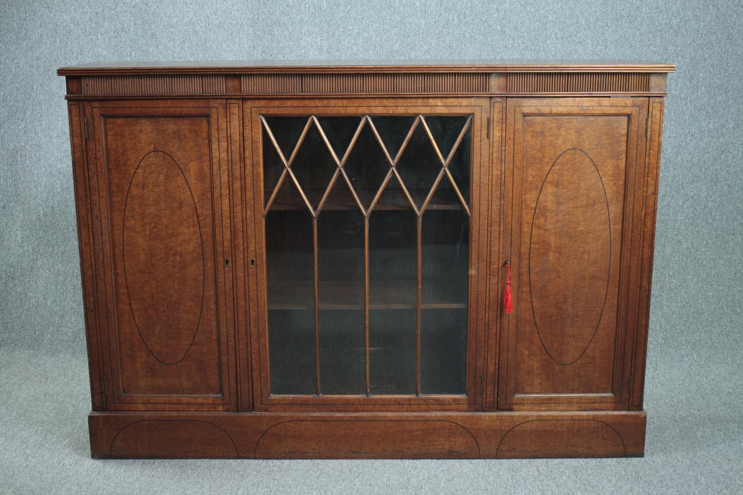 Dwarf bookcase cabinet, early 20th century, burr walnut and ebony inlaid. H.107 W.153 D.32cm.