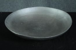 A large circular metal platter. Dia.49cm.