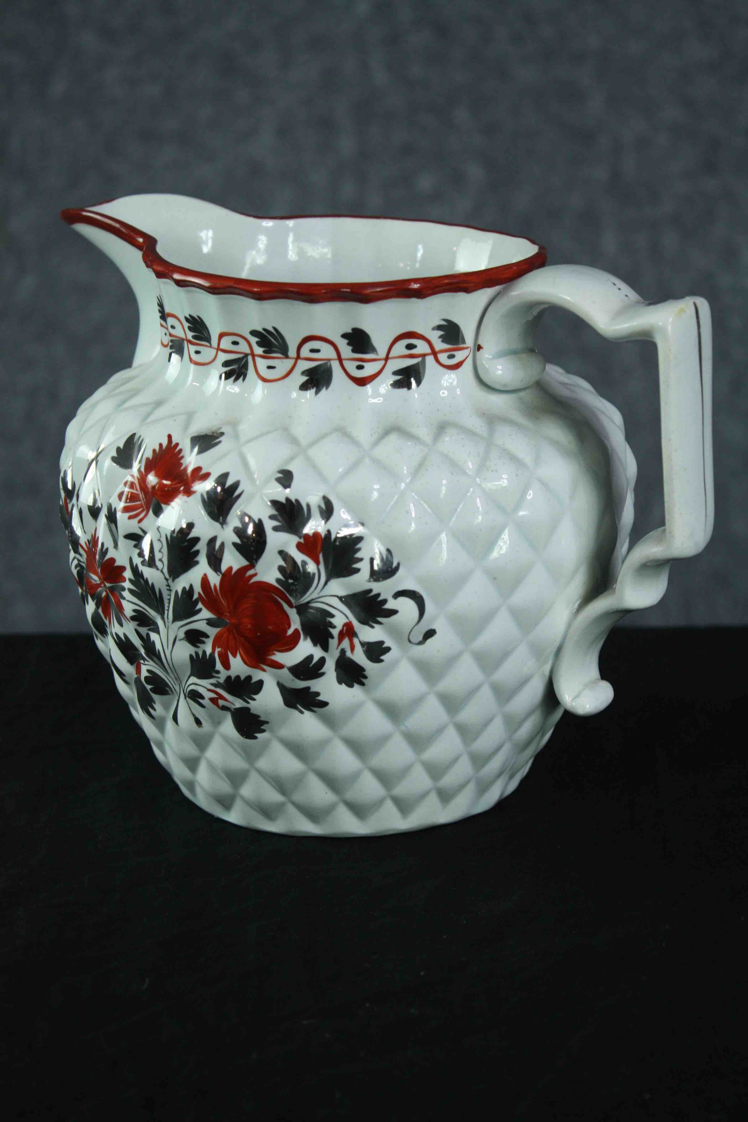 An early 19th century pineapple moulded jug with silver lustre and red enamel floral decoration. H. - Image 3 of 5