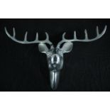 A chrome metal stag's head. H.39 W.57 cm.