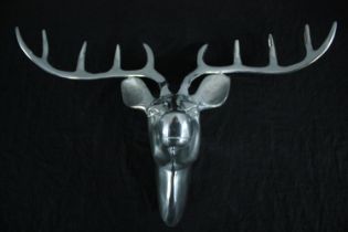 A chrome metal stag's head. H.39 W.57 cm.