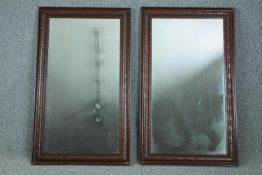 A pair of C.1900 oak framed mirrors. H.93 W.55cm. (each)