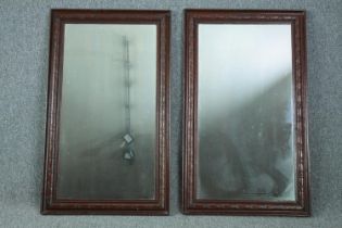 A pair of C.1900 oak framed mirrors. H.93 W.55cm. (each)