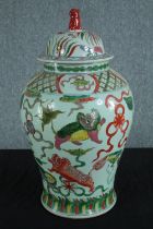 A Chinese lidded pot hand painted and decorated with dragons. Twentieth century. H.58 Dia. 30 cm.