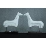 Pair of carved horses painted white. One with damaged base. H.57 w.53cm. (each)