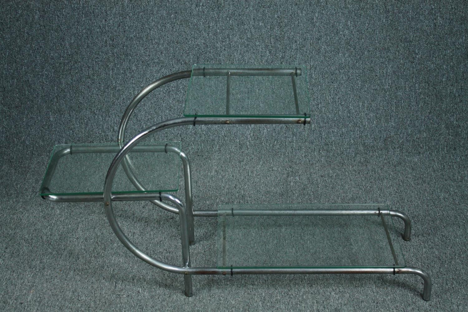 After Emile Guillot, a 1930's plate glass and chrome etagere in the Bauhaus style. H.56 W.105 D.