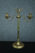 A brass candelabra. Decorated with an eagle finial. Twentieth century. H.40 W.29cm.